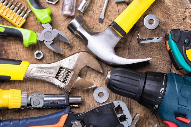 Set of tools over a wood background