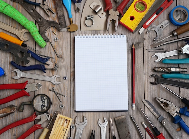    Set of tools on a wooden floor, top view. 