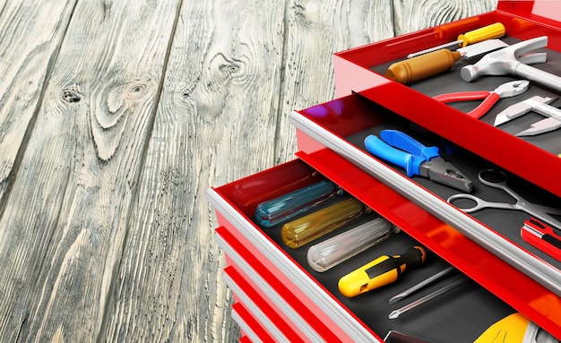 Set of tools in work boxes on background