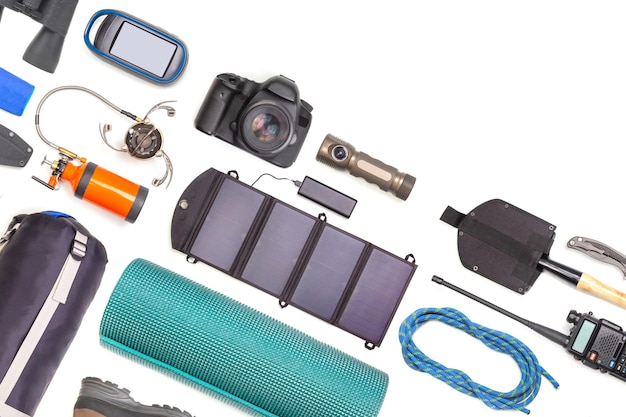 Set of tourist trekking items on white background Top view of accessories for travel Equipment