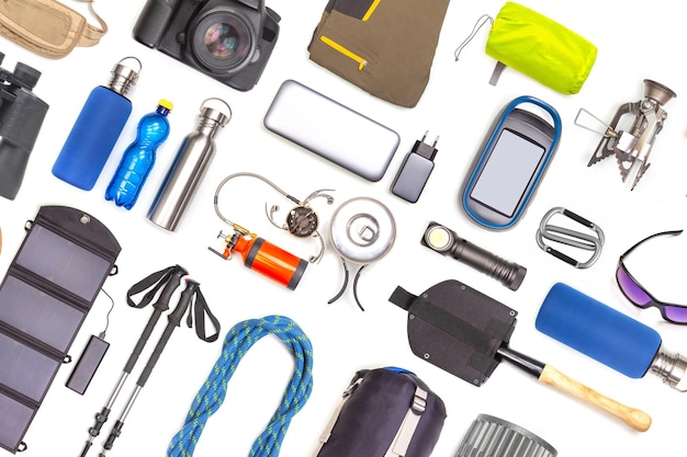 Set of tourist trekking items on white background top view of accessories for travel