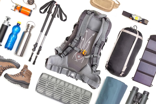 Set of tourist trekking items on white background