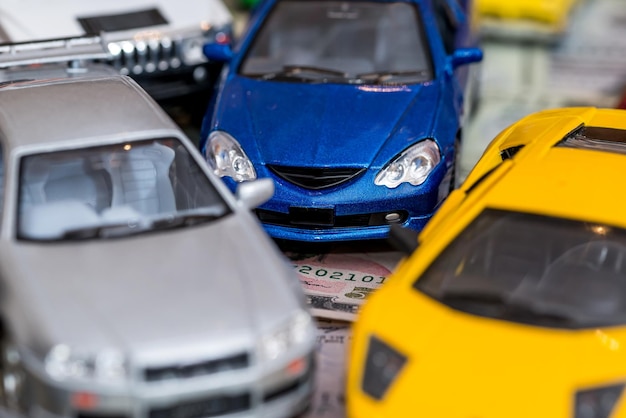 Set of toy car on background with us dollars banknotes