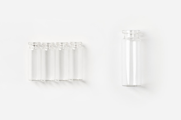 Set of transparent empty jars on a light background