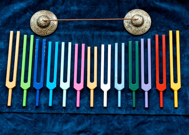 Photo set of tuning forks and bells  sound healing and acutonic tools for music therapy
