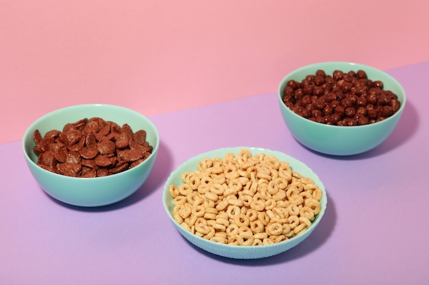 Set of various breakfast cereals on colorful background