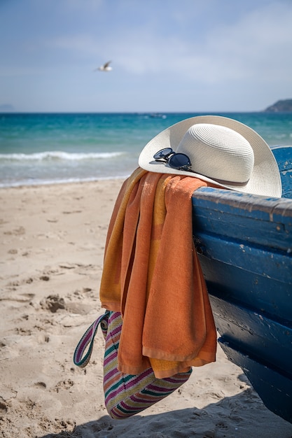 Set of various clothes and accessories for women on the beach
