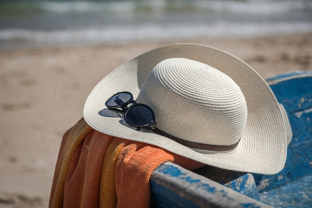 Set of various clothes and accessories for women on the beach