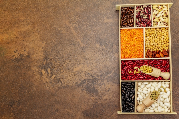 Set of various dry legumes in wooden box