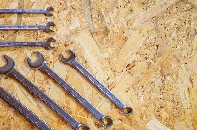 Set of various repair hand tools or auto mechanic's tools. repair tool kit. equipment for building. wooden background, pattern, top view. space for text