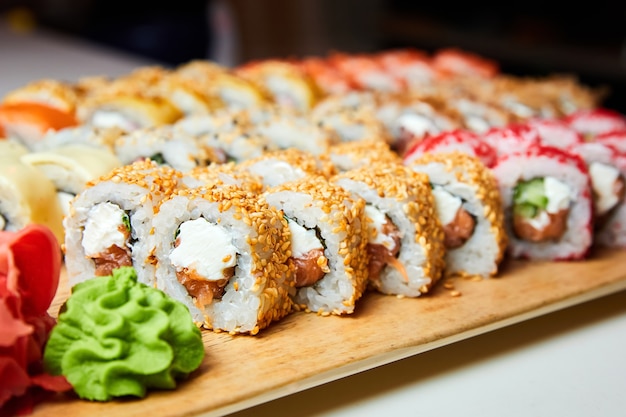 Set of various sushi rolls on a board