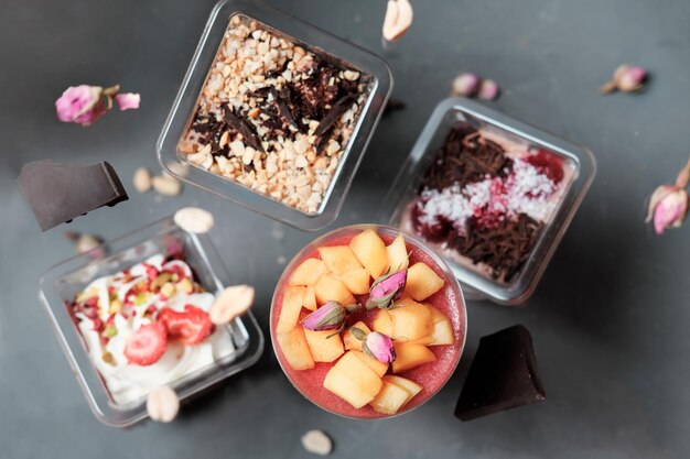 Photo set of various trifle cakes with layers of sponge cake and berry and chocolate filling sponge cake made with jam filling autumn sweet treats levitating food