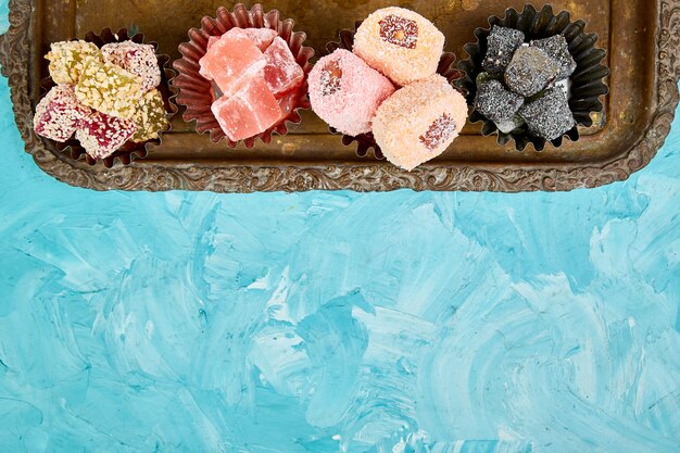 Set of various Turkish delight in bowl on metal tray