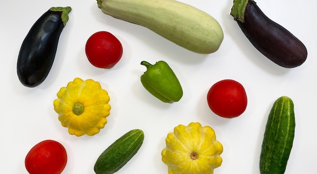 Set of vegetables isolated on a white background eggplant zucchini tomatoes peppers cucumbers Healthy food concept