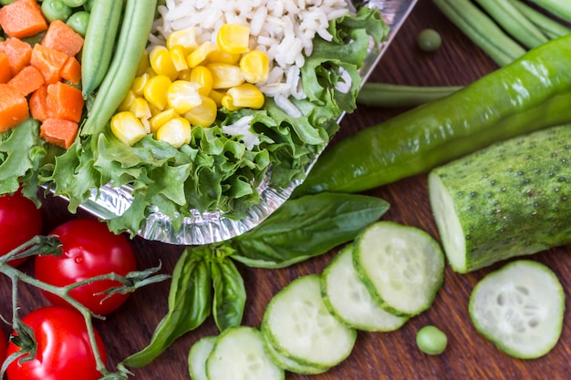 A set of vegetables with rice for a healthy diet: corn, peas, asparagus, carrots, broccoli, lettuce