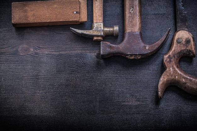 Set of vintage construction tools on wooden board