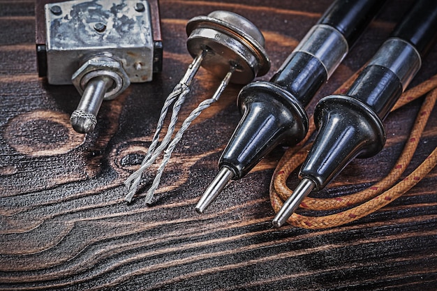 Set of vintage electric equipment on wooden board electricity concept