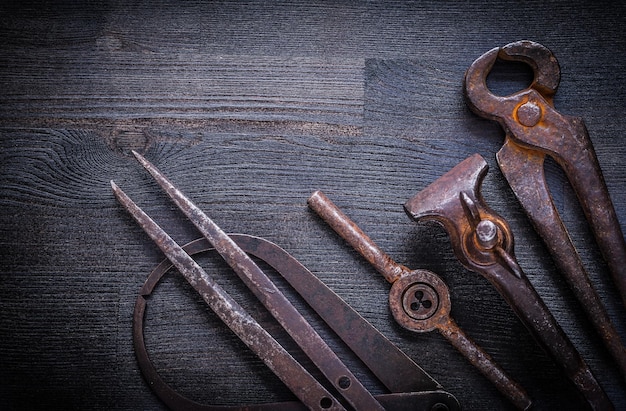 Set of vintage tools on wood board