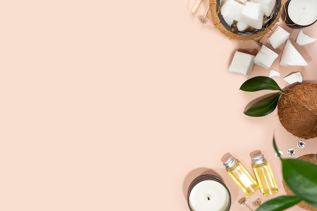 Set voor zelfgemaakte natuurlijke ecovriendelijke kokoswas kaarsen lont parfum aroma olie kaarsen maken gebruiksvoorwerpentrendy diy kaarsen voor de gezondheid op roze achtergrondkopieer ruimtecrueltyfree veganistisch product