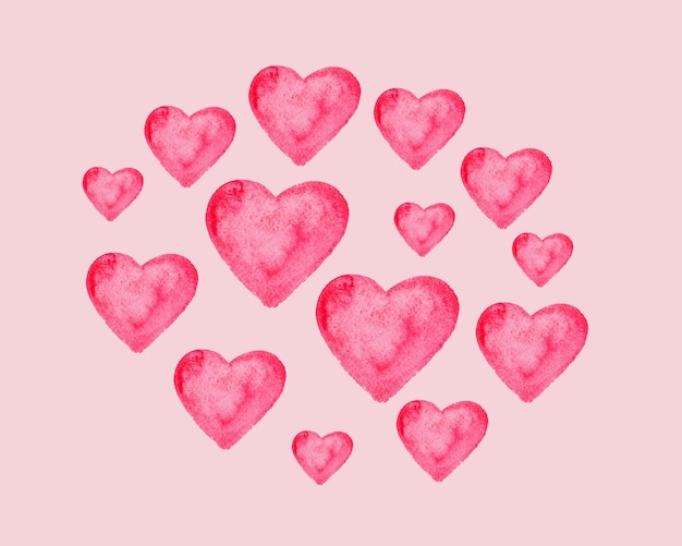 Set of watercolor hearts on a pink background