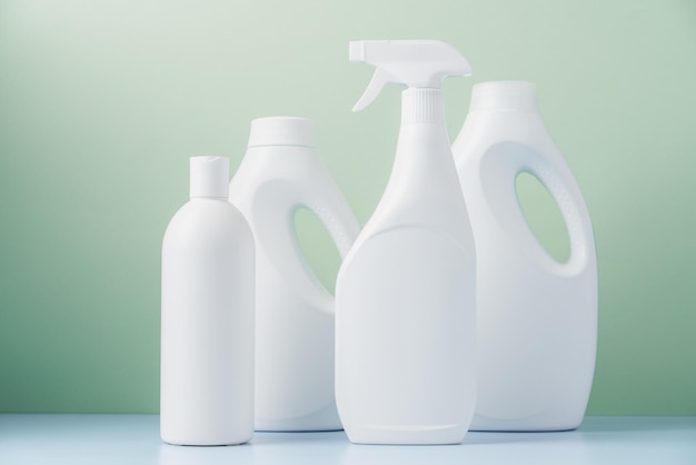 Set of white bottles with cleaning products Cleaning service concept