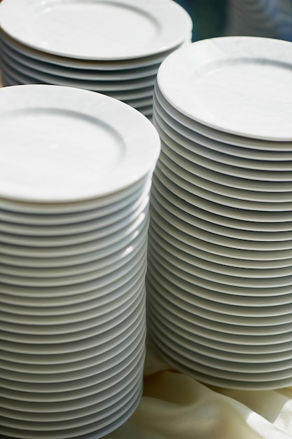 Set of white dishes isolated on whiteStack of plates