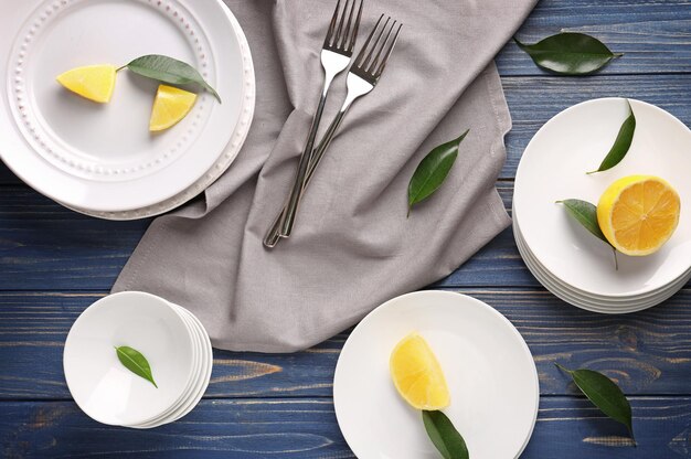 Photo set of white dishes on vintage wooden table