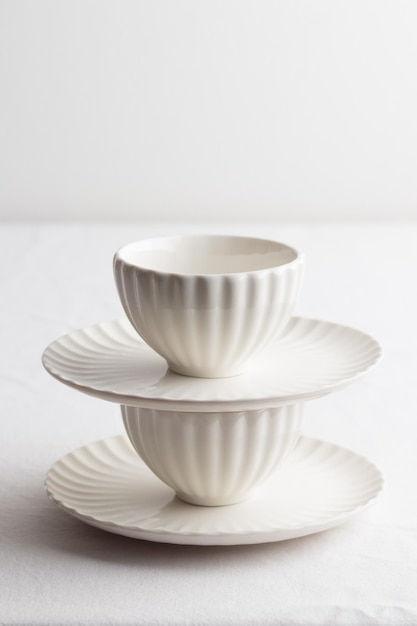 Set of white dishes on a white table