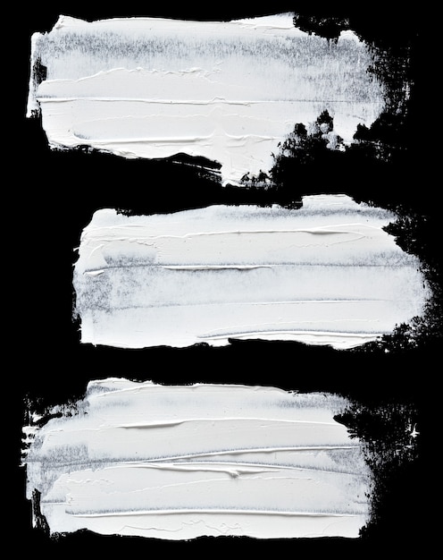 Set of white oil paint brush strokes isolated on the black background