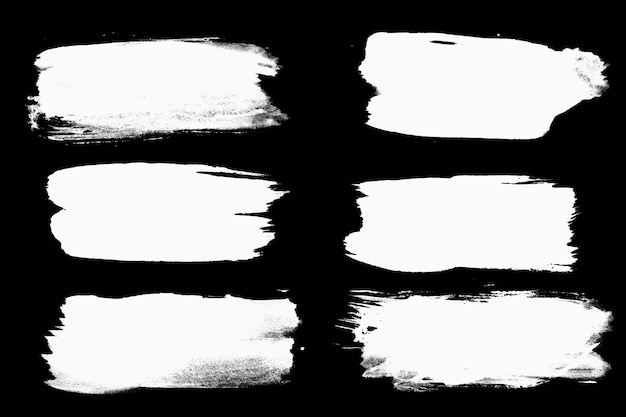 A set of white strokes isolated on a black background. High quality photo