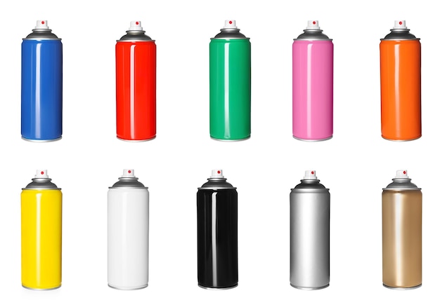 Set with colorful cans of spray paints on white background