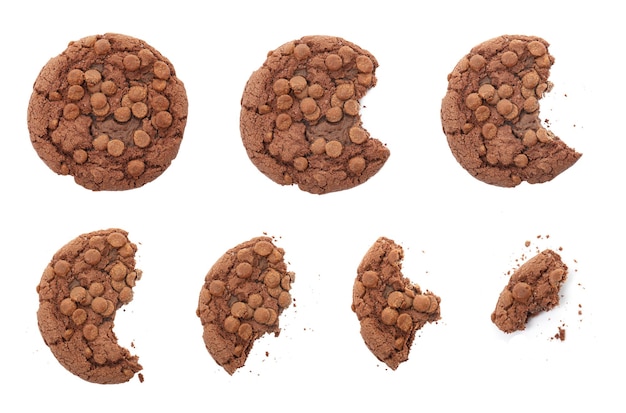 Photo set with delicious chocolate chip cookies on white background top view