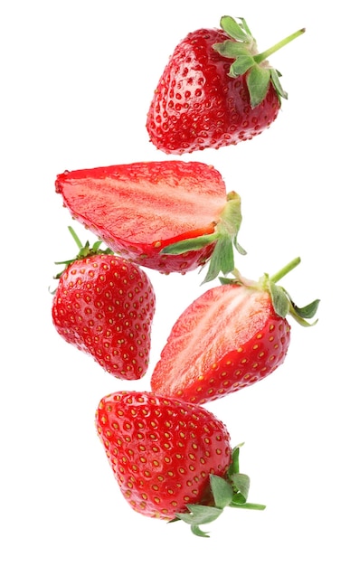 Set with ripe strawberries falling on white background