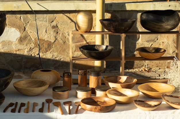 Set of wooden utensils on the table Plates and cutlery Wooden items