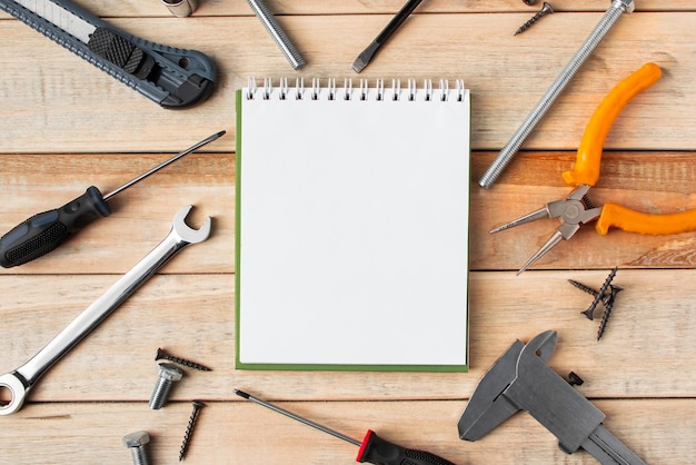 Set of work tools on a wooden background. Festive greeting card concept for Father's day.