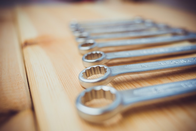 Set of wrenches for repair on wooden table