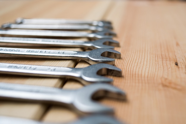 Set of wrenches for repair on wooden table