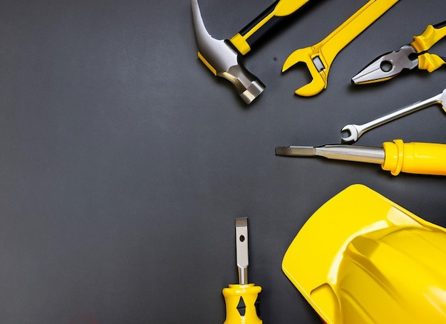 Set of yellow tools on black background