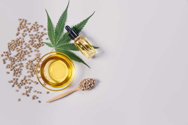Sets of legalized marijuana features with CBD oil in bottle with dropper lid