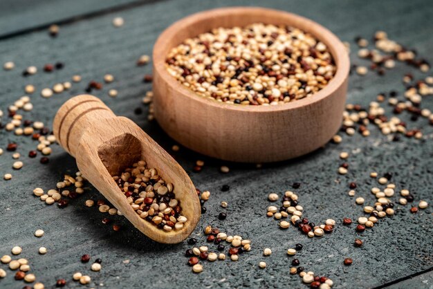 Sets quinoa seeds on a wooden bowl Healthy and diet superfood product Food recipe background Close up