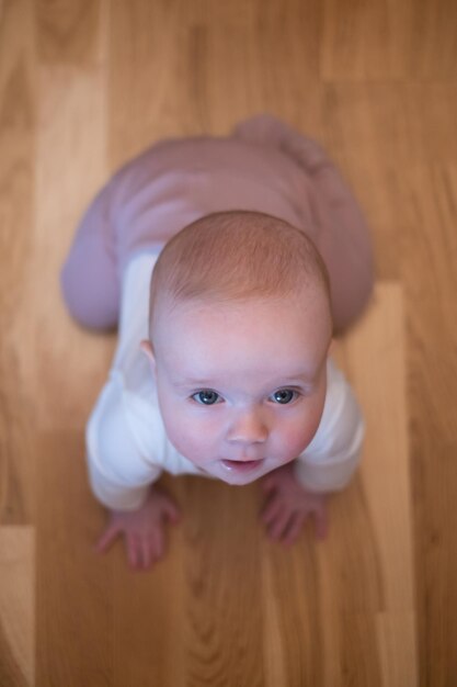 Seven months old caucasian baby on the floor