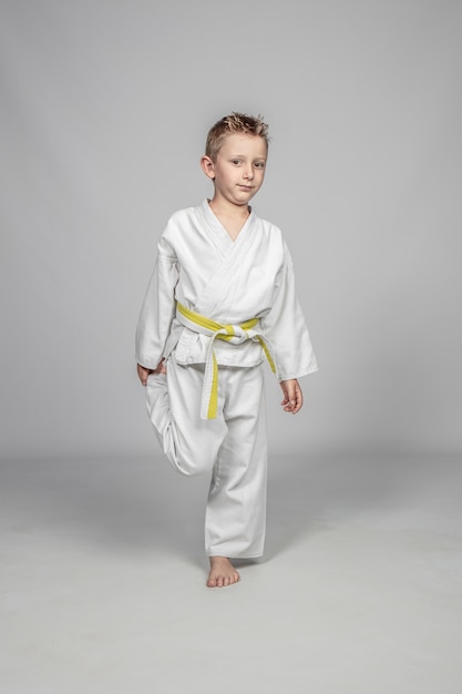 Seven year old caucasian child practicing martial arts.