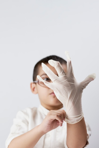 Seven years old boy wearing protective gloves