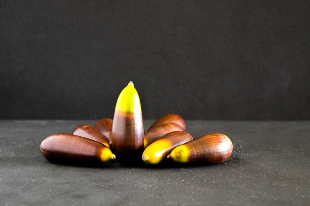 Several acorns on a dark background