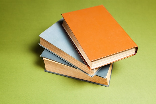 Several books on a green background