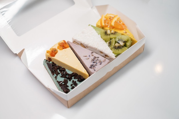 Several cakes are symmetrically laid out delivery box homemade\
baking and food delivery concept