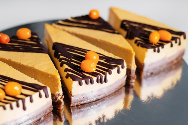 Several cakes are symmetrically laid out on a plate food\
delivery homemade baking close up