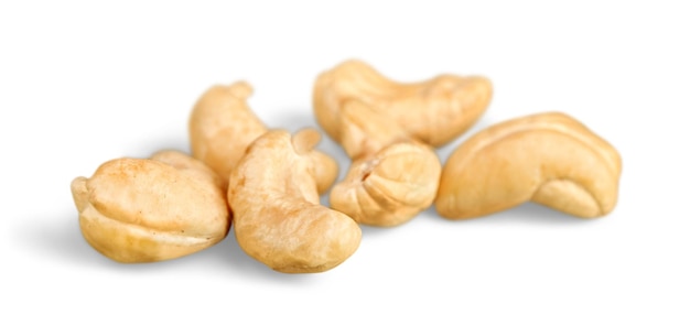 Several cashew nuts on white