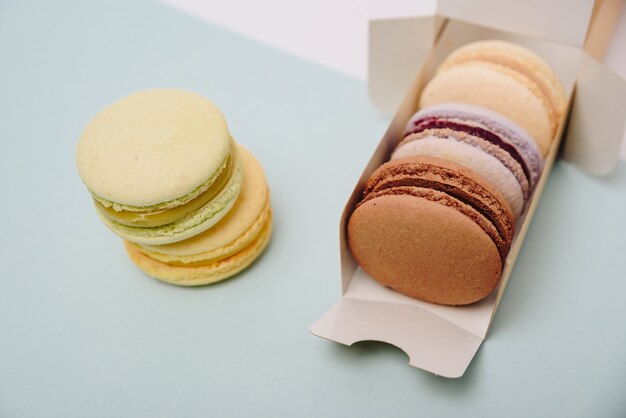 Several colorful macaroon cakes in box