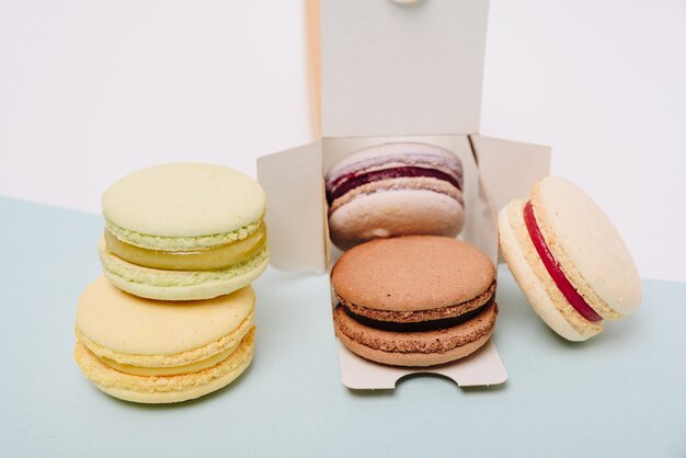 Several colorful macaroon cakes in box